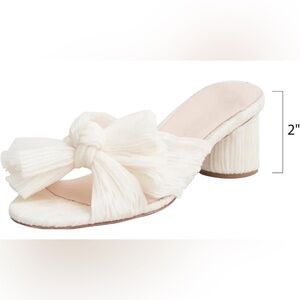 Brand new. Bow Heeled Sandals with 2 inch block heel size 9. Bridal shoes.